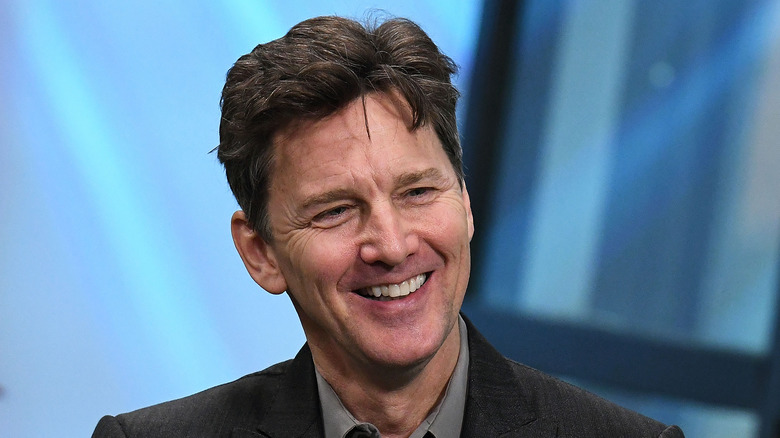 Andrew McCarthy smiling in blazer 