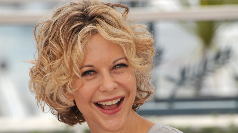 Meg Ryan smiling outside