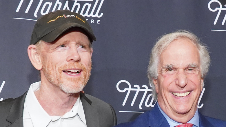 Henry Winkler and Ron Howard smiling on the red carpet