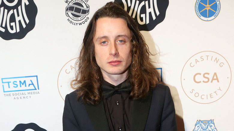 Rory Culkin posing at event