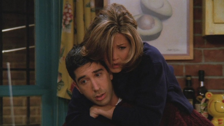 Rachel riding on Ross' back