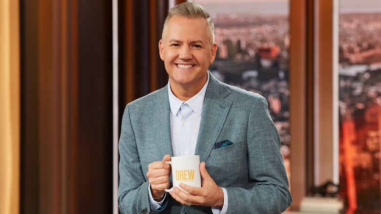 Ross Mathews smiling on the set of The Drew Barrymore Show