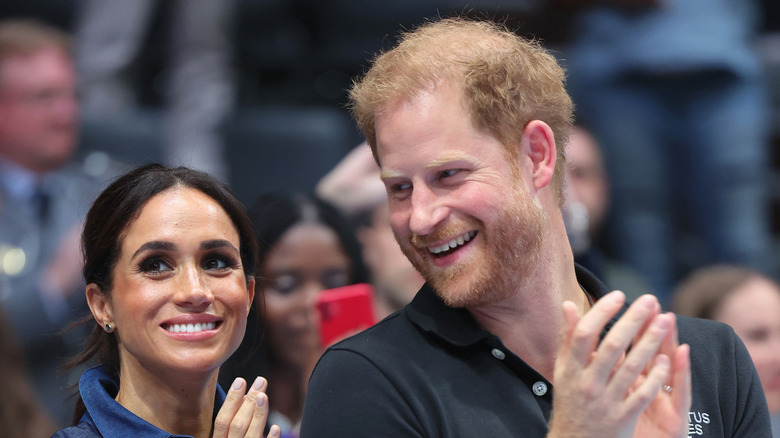 Prince Harry and Meghan Markle clapping