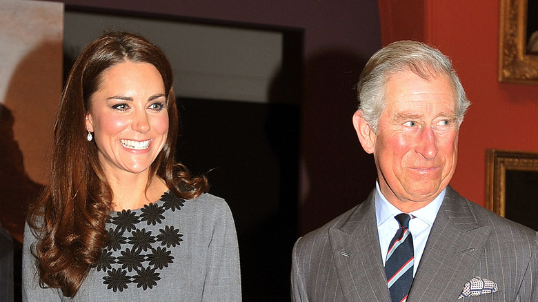 Prince Charles and Kate Middleton at an event. 