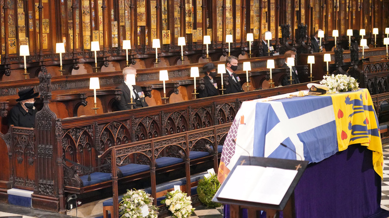 Queen Elizabeth II looks at the coffin of her husband the Duke of Edinburgh