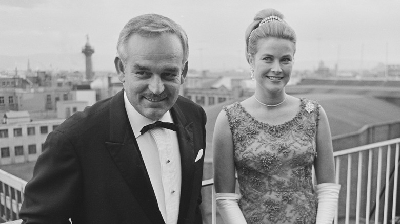 Prince Rainier III and Grace Kelly posing in evening wear