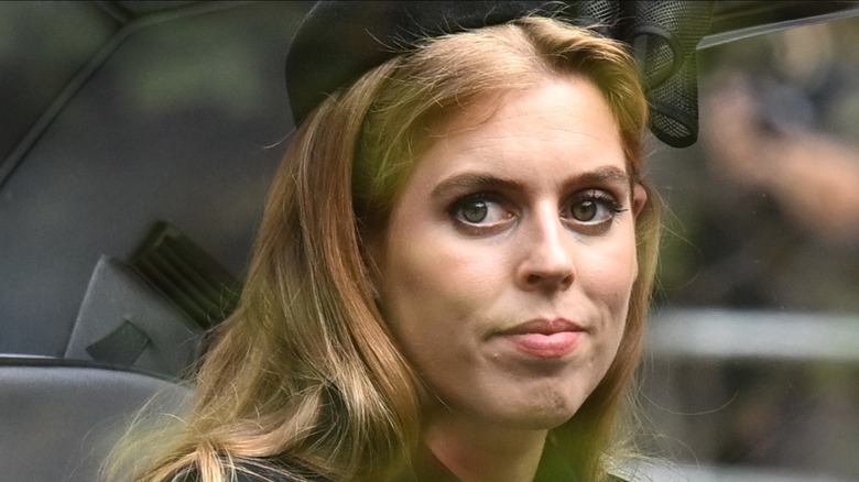 Princess Beatrice looking sad in car