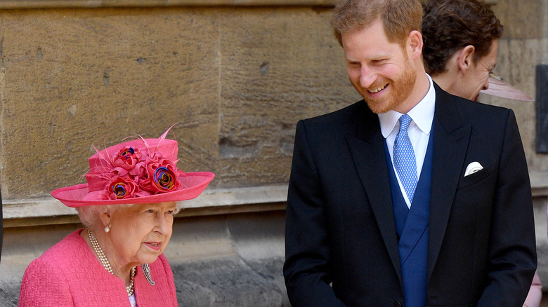 Prince Harry smiles at the queen