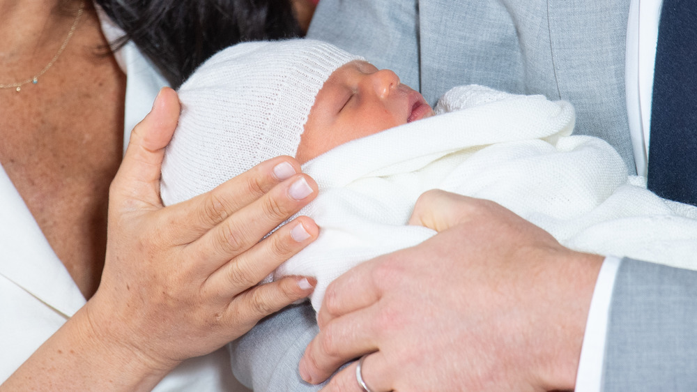 Archie Mountbatten as newborn wearing white hat