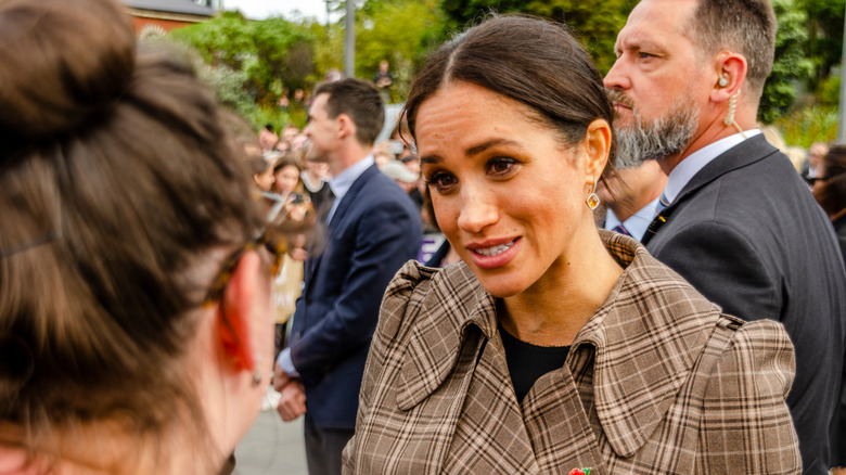 Meghan Markle speaking with reporter