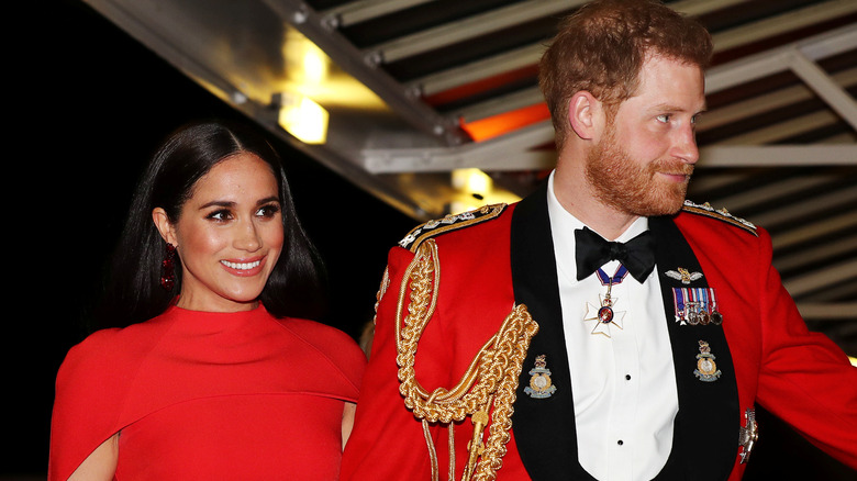 Meghan Markle and Prince Harry in red