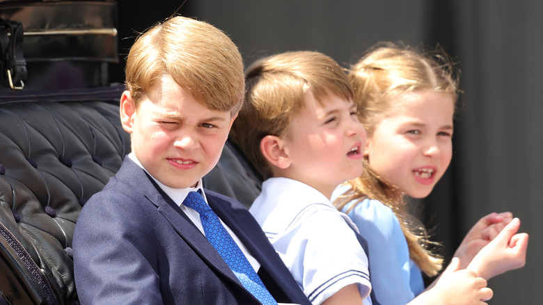 Prince George, Princess Charlotte, and Prince Louis in carriage