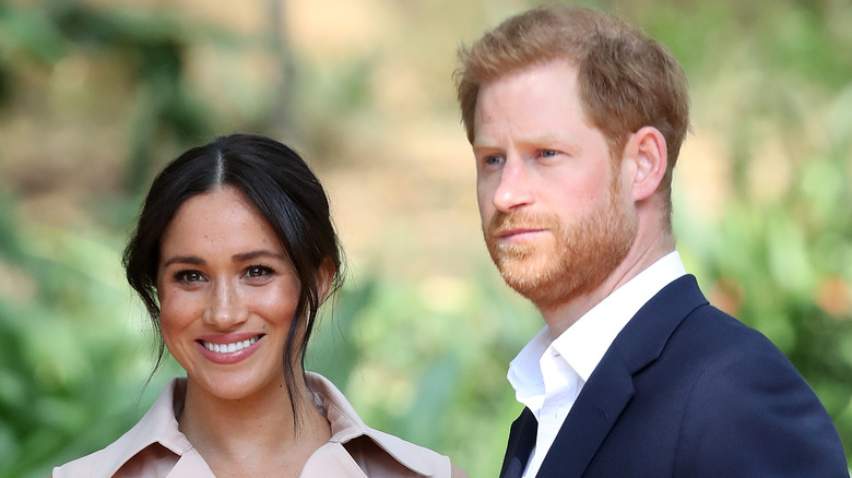 Meghan and Harry pose for photographers