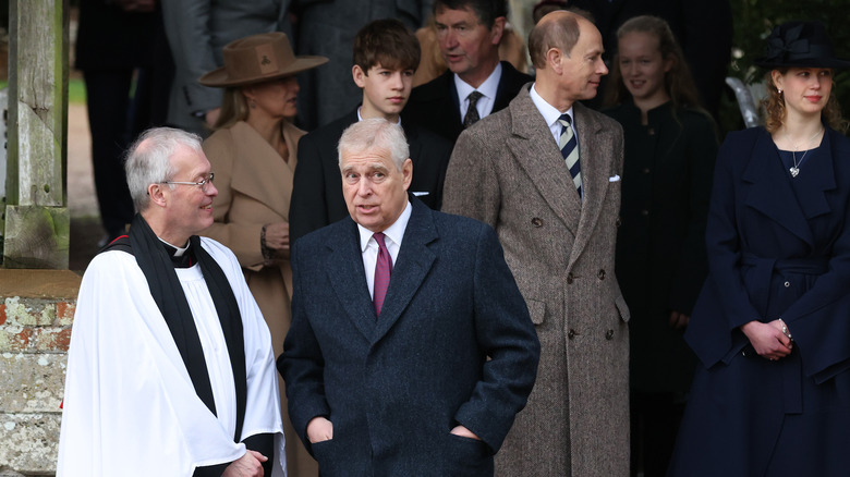 prince andrew talking to priest at christmas celebratio