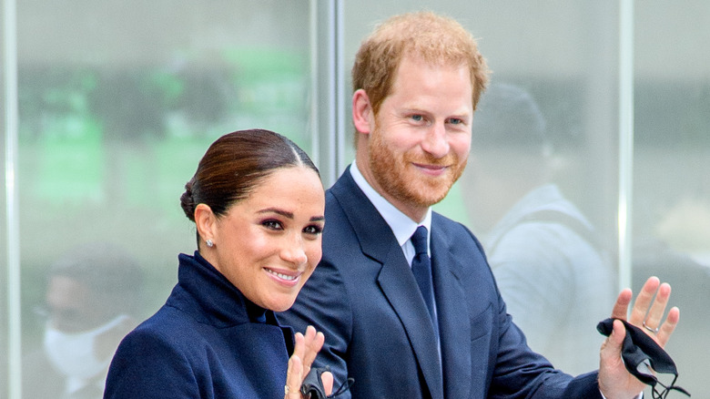 Meghan Markle and Prince Harry waving