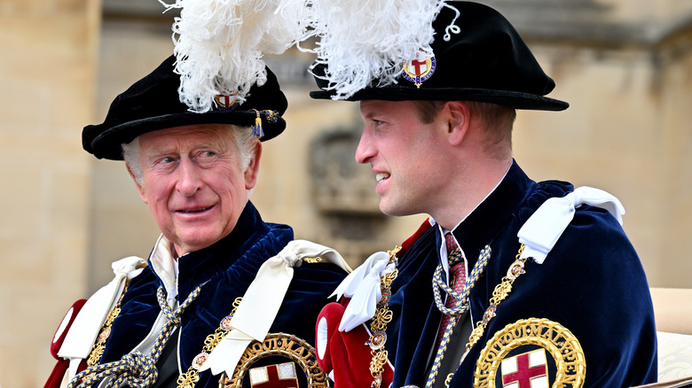 King Charles and Prince William in royal regalia