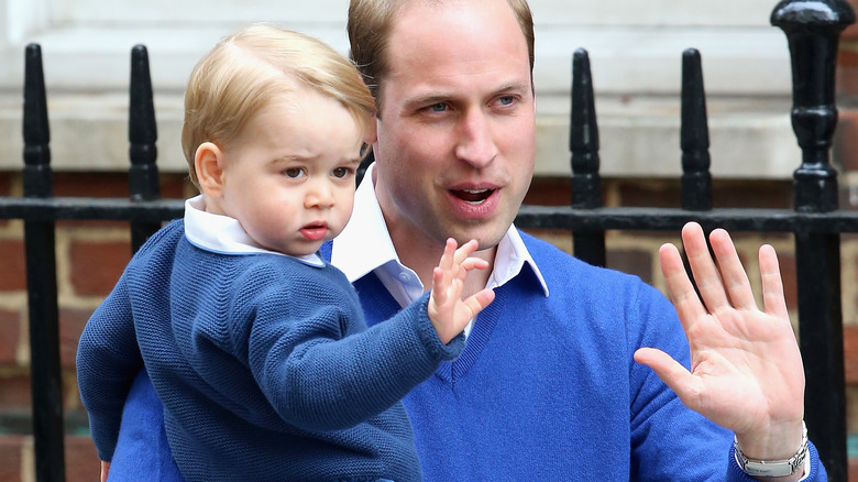 Prince George and father Prince William waving