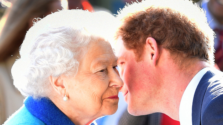 Queen Elizabeth and Prince Harry kiss