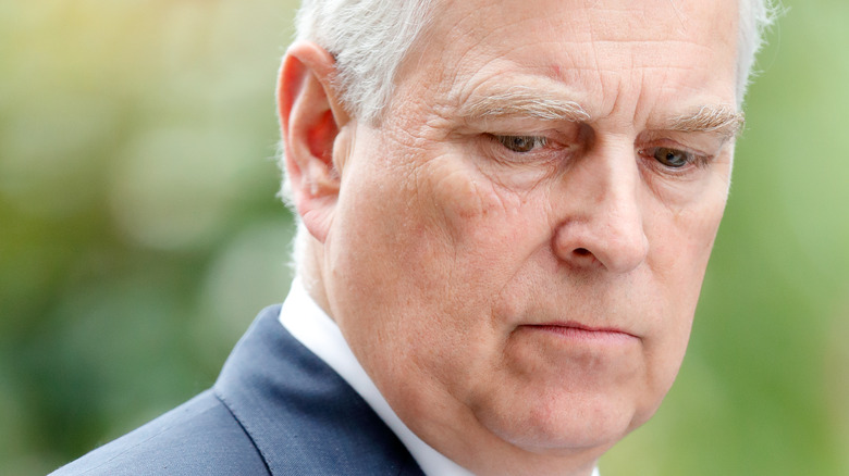 Prince Andrew looking down 