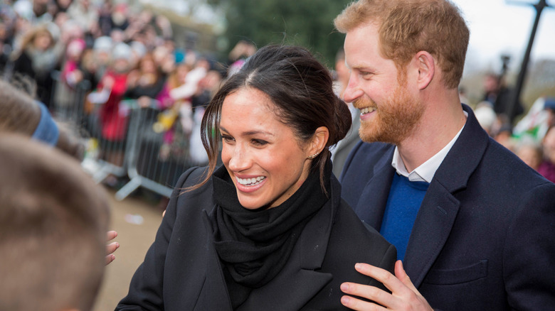 Prince Harry and Meghan, Duchess of Sussex smiling