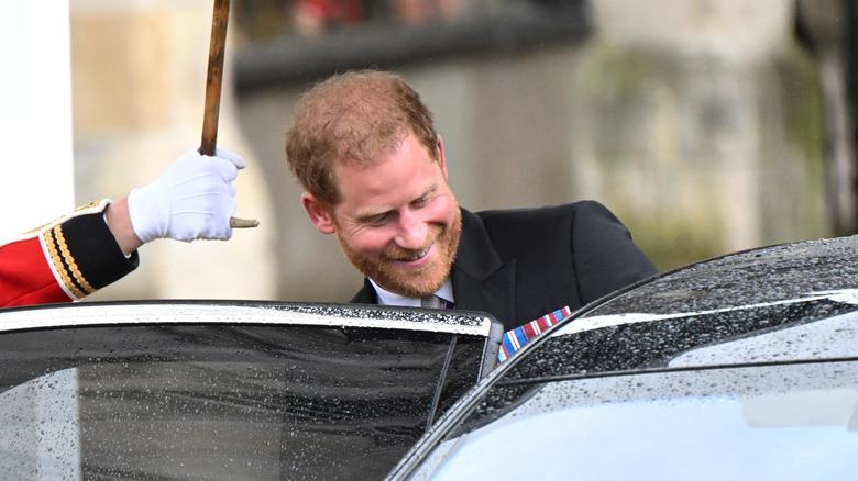 Prince Harry getting into a car