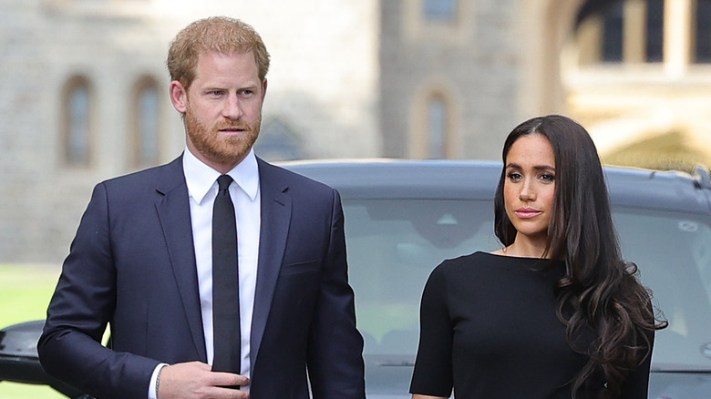 Prince Harry and Meghan Markle outside