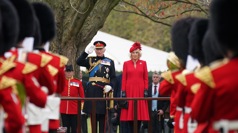 Charles and Camilla with guard