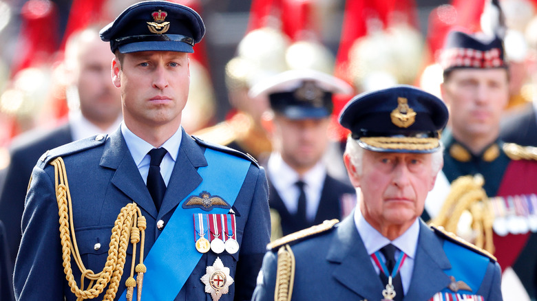 Prince William and King Charles standing 