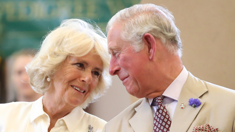 Charles and Camilla looking lovingly at each other