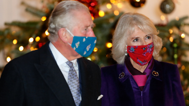 Charles and Camilla in masks at Christmas
