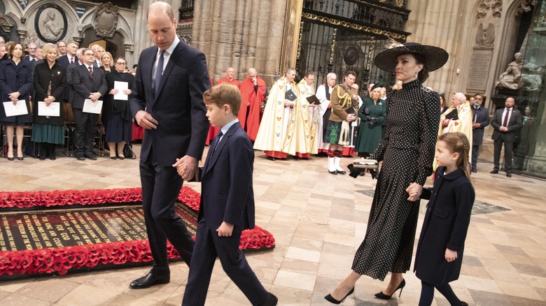 The Cambridge family walks into the memorial