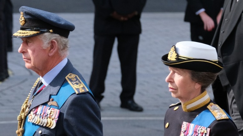 King Charles and Princess Anne walking