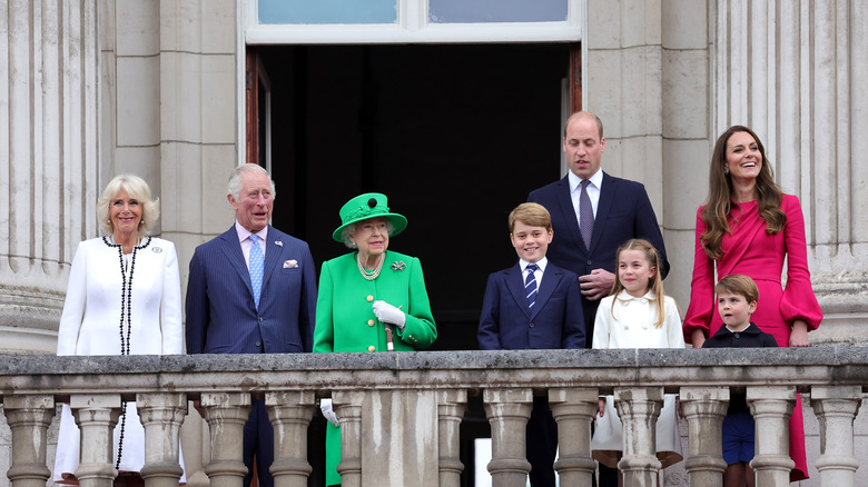 The royal family posing on a balcony 