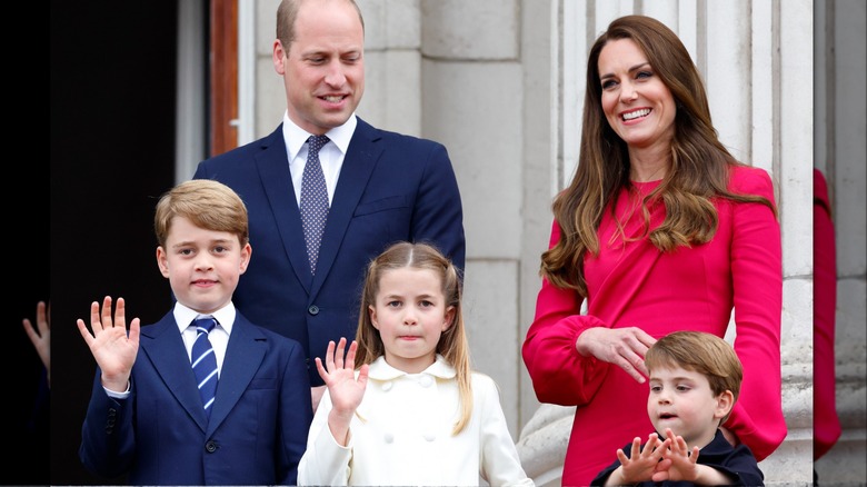 Prince and Princess of Wales waving with kids