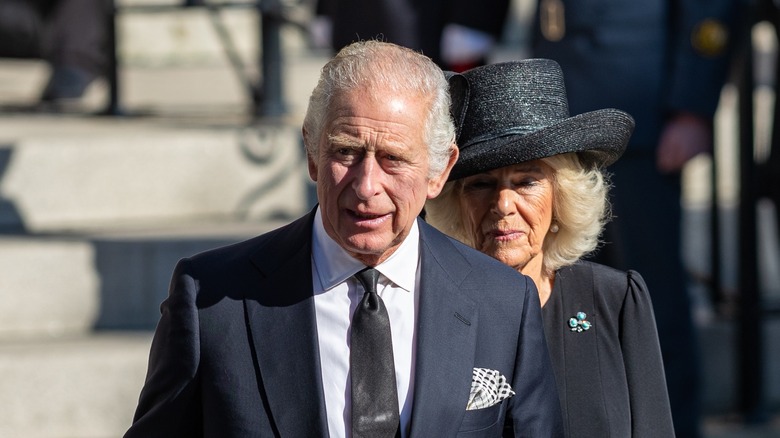 King Charles III and Queen Camilla walking