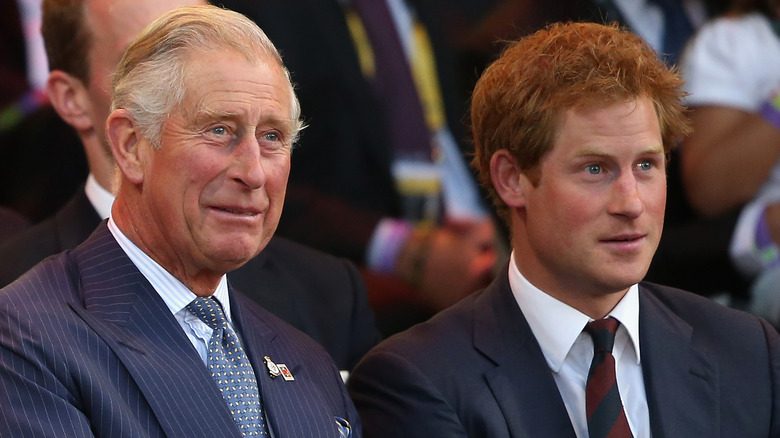 Prince Charles and son Prince Harry smiling 