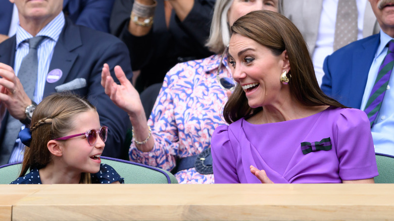 Kate Middleton smiling at Princess Charlotte