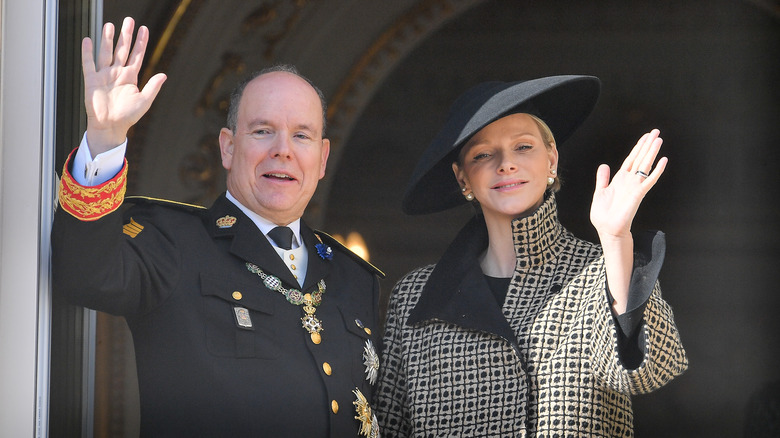 Prince Albert and Princess Charlene waving