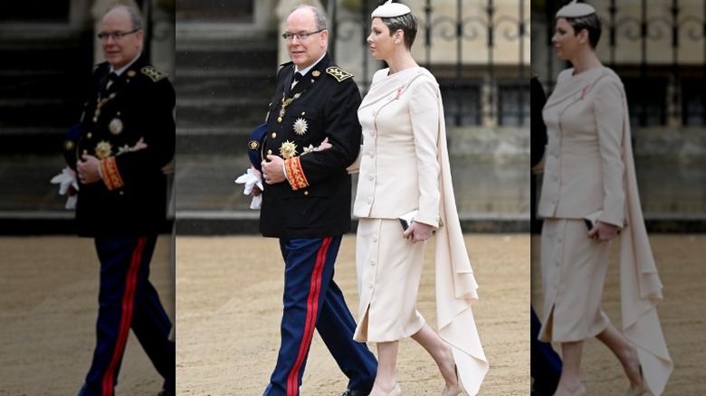 Prince Albert and Princess Charlene walking outside