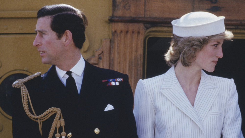 Prince Charles and Princess Diana, looking in different directions