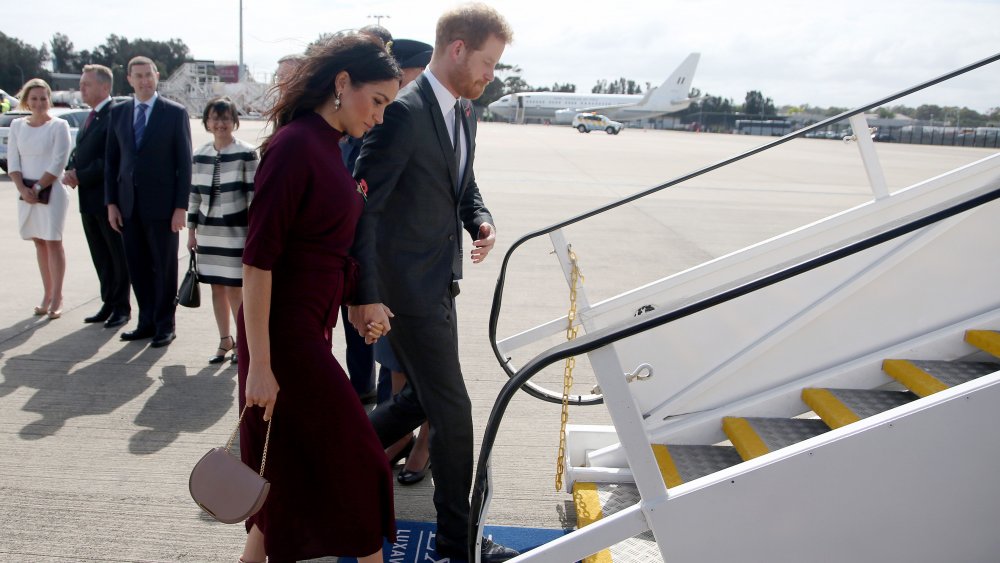 Meghan Markle and Prince Harry boarding a plane