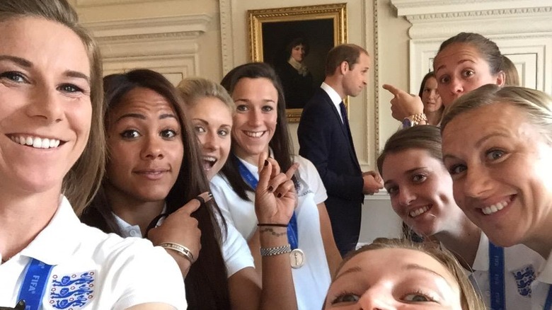 William photobombing women's soccer team photo