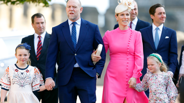 Zara and Mike Tindall walking with their daughters