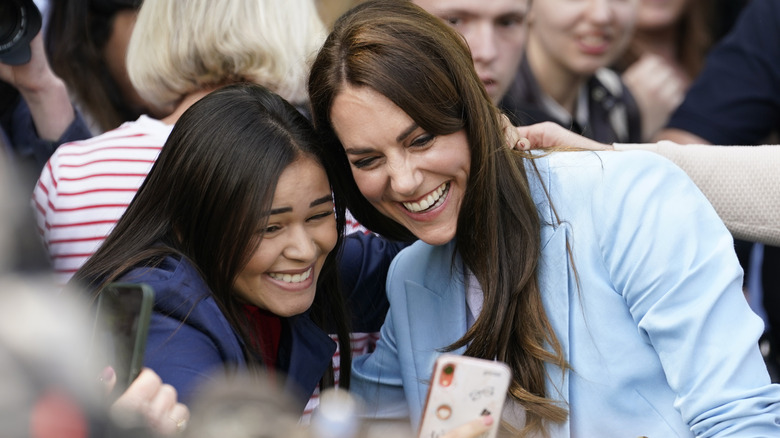 Kate Middleton takes a selfie with a fan