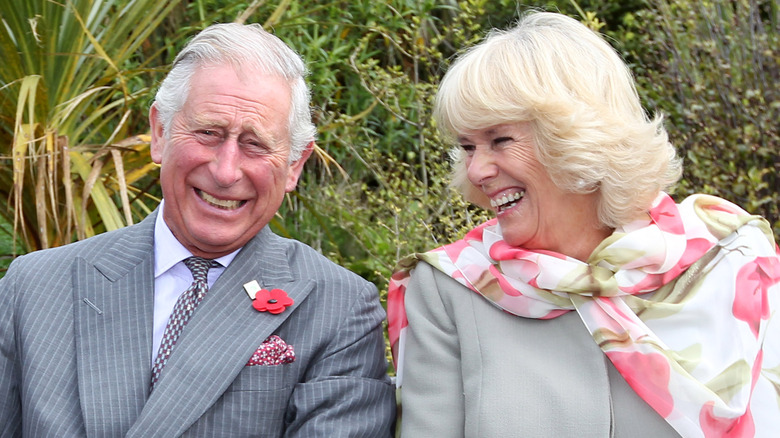 King Charles III and Camilla laughing