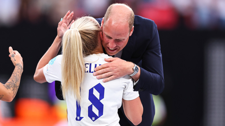 Prince William hugging a Lioness player