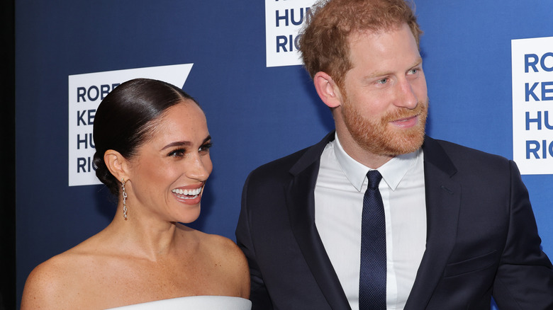 Meghan Markle laughing with Prince Harry