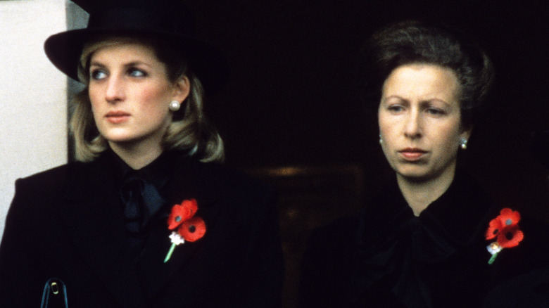 Princess Diana and Princess Anne wearing black