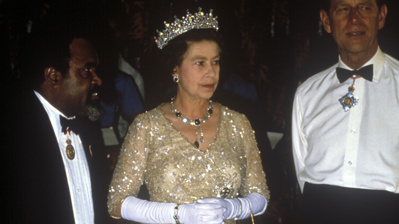 Queen Elizabeth II in glittery gown and crown