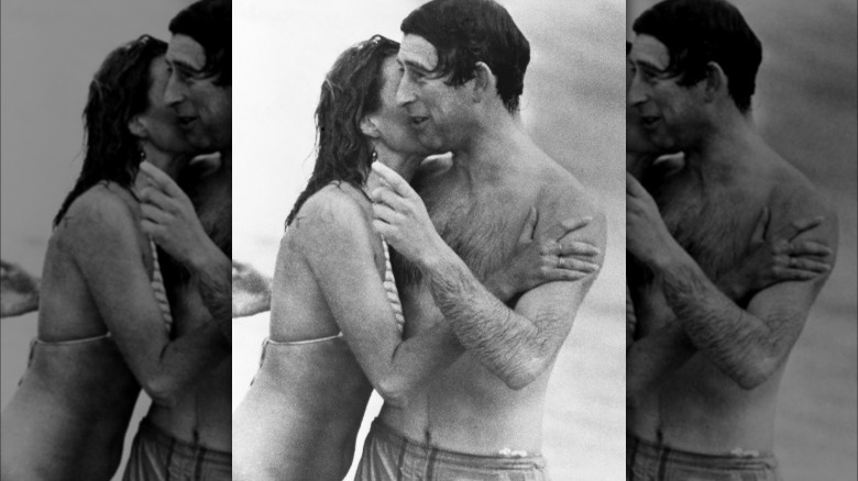 King Charles III pictured with a woman on the beach